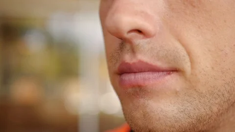 A man with an appetite eats a fork with delicious food, close-up. slow motion Stock Footage 90420544