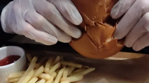 Man with appetite eats juicy burger Stock Footage 171397689