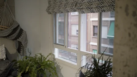 Man applauding from his window in solidarity with those who work in the pandemic Stock Footage 129103014