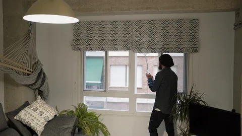 Man applauding from his window in solidarity with those who work in the pandemic Stock Footage 129103060
