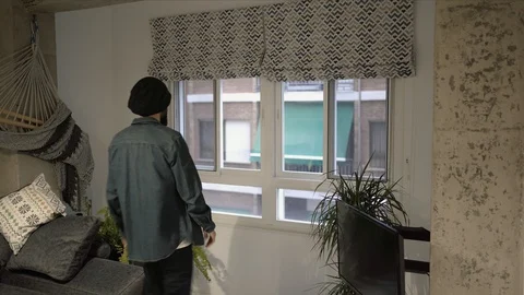 Man applauding from his window in solidarity with those who work in the pandemic Stock Footage 129103075