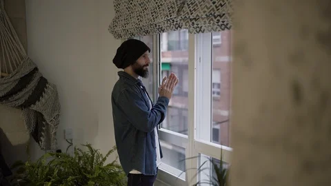 Man applauding from its window in solidarity with those working against the glob Stock Footage 129103009