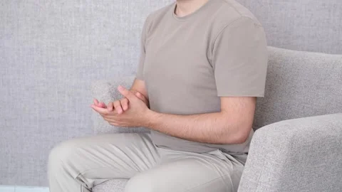 Man applauding on sofa Stock Footage 277693486