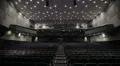Man applauds alone in the theater. Wide shot. HD Footage
