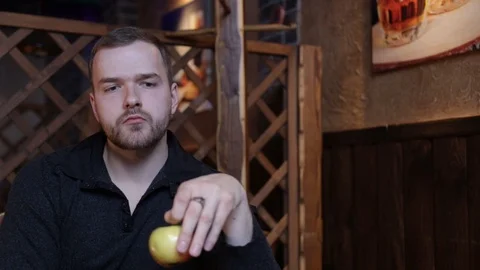 Man with an apple Stock Footage 122821785