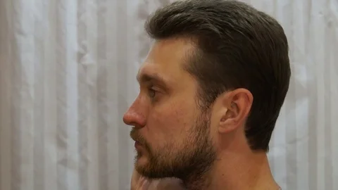 Man applies shaving foam Stock Footage 80490198