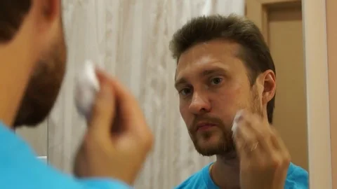 Man applies shaving foam Stock Footage 80490390