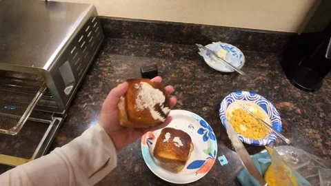Man applying butter on tuna bread toast for breakfast. POV. 스톡 동영상 321497967