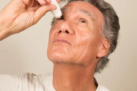 Man Applying Eye Drops Stock Photos