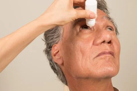 Man Applying Eye Drops Stock Photos