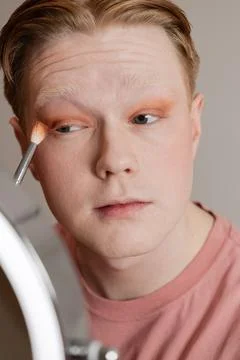 Man Applying Eyeshadow with Brush Vertical Extreme Close Up Stock Photos