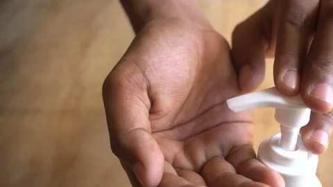 Man applying hand sanitizer to hands Stock-Footage 130439459
