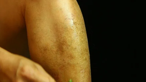 Man applying himself by aloe vera , in  door  Chiangmai Thailand Stock Footage 129136384