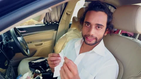 Man applying makeup in car mirror busy lifestyle concept an actor getting r.. Stock Footage 270200398