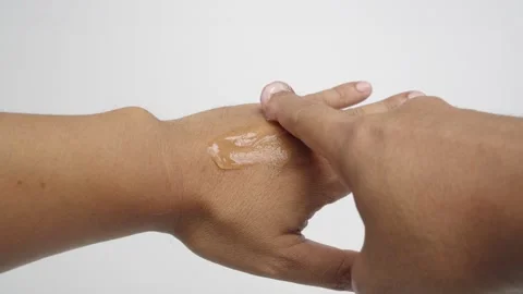 Man applying moisturizing Aloe Vera gel To his hand. Stock Footage 233447412