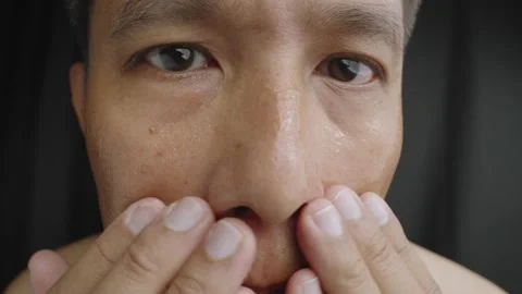 Man applying moisturizing Aloe Vera gel To his face. Stock Footage 235002125