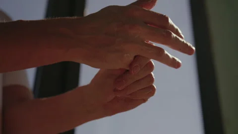Man applying moisturizing cream, rubbing nourishing lotion or liniment to dry Stock Footage 313226117