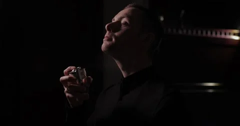 Man applying perfume on his neck, slow motion Stock-Footage 235540230
