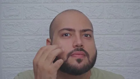 Man Applying Pimple Patch on Face Stock Footage 300184422