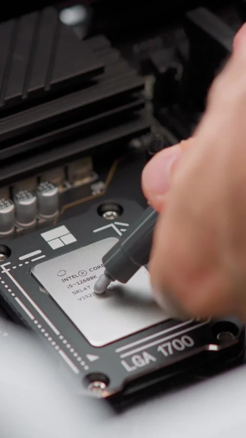 Man applying thermal paste to a CPU. Computer hardware. Close up Stock Footage 310315471