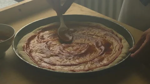 Man Applying Tomato Sauce on Pizza Dough, Homemade Healthy Food Stock Footage 137453845