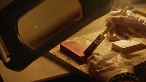Man Applying Varnish to Wood Block in Carpentry Workshop Stock Footage 340402028