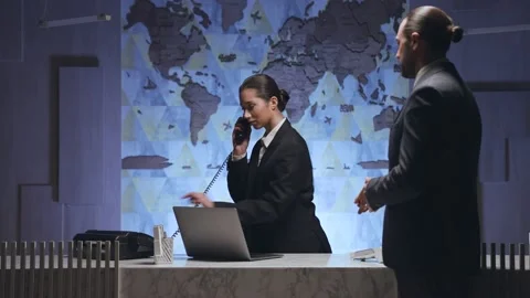 Man approached the receptionist and asking, the woman calls, let the man pass Stock Footage 233994594