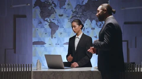 A man approached the receptionist, asking something, complaining. Stock Footage 233994605