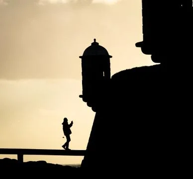 Man Approaches Lighthouse Stock Photos