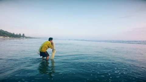 Man Approaches Stealthy To Catch Fish Stock Footage 93166776