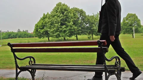 Man approaching bench Stock Footage 39655716