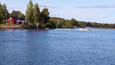 Man approaching dock with smaller boat Stock Footage 249896563