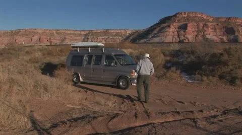 Man approaching parked van Stock Footage 61575722