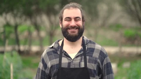 Man with apron smiling at camera Video stock 171432050