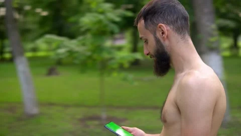 A man of Arab appearance with a beard and without a T -shirt runs in a park with Video stock 199293073