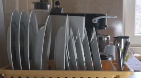 Man Aranges Dishes In A Stand Side Shot Vídeos de archivo 36293723