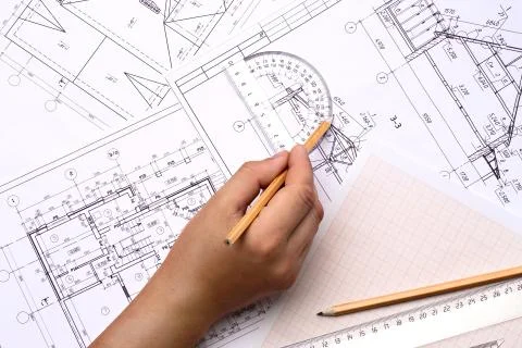 Man architect draws a plan , schedule , design , geometric shapes with a pencil  Foto stock