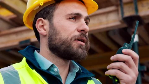Man, architect or talking with radio on construction site for building Stock Footage 336213638
