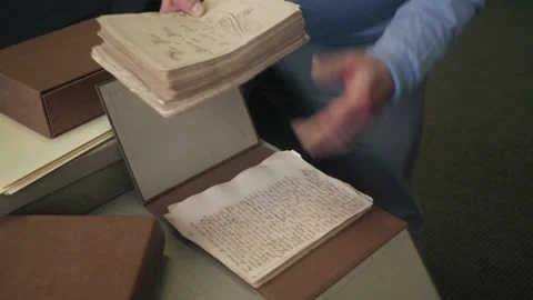 Man in Archives sorting old historical documents and letters liberty Video stock 238851815