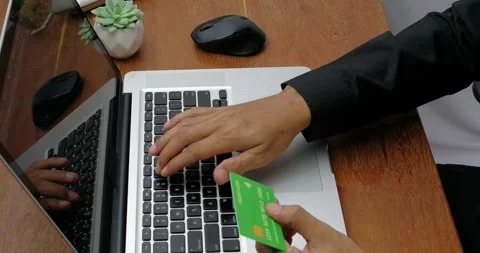 Man are using the laptop and doing online transactions at home. Video stock 316769793