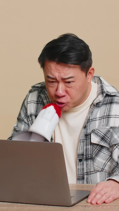 Man arguing talking on laptop conversation by webcam, quarrels, expresses a Stock Footage 313955278