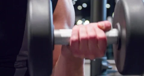 Man arm weight training biceps muscles dumbbells gym 4k close-up exercise video Stock Footage 71801531