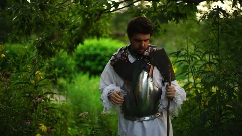 Man in armor waiting around or larping Stock Footage 78737533