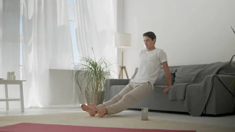 Man arms exercise on the couch, triceps dip training, Healthy lifestyle covid-19 Video stock 134748225