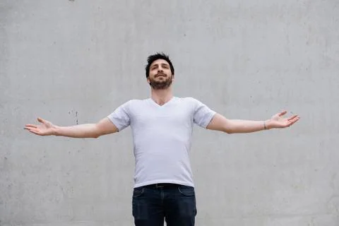 Man with arms outstretched Stock Photos