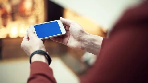 Man arms using smartphone with chroma screen in shopping mall Stock Footage 82989829