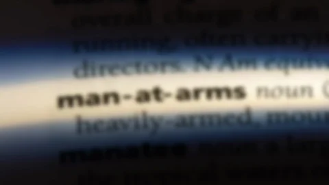 Man at arms word in a dictionary. Stock Footage 99563297