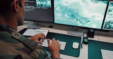 Man, army and typing with computer screen in control room, military battle and Foto stock