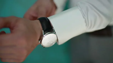 A man arranging his watch Video stock 50350385