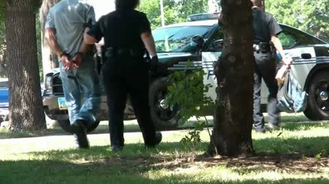 Man is Arrested and Handcuffed - Escorted to Police Car 스톡 동영상 12597713